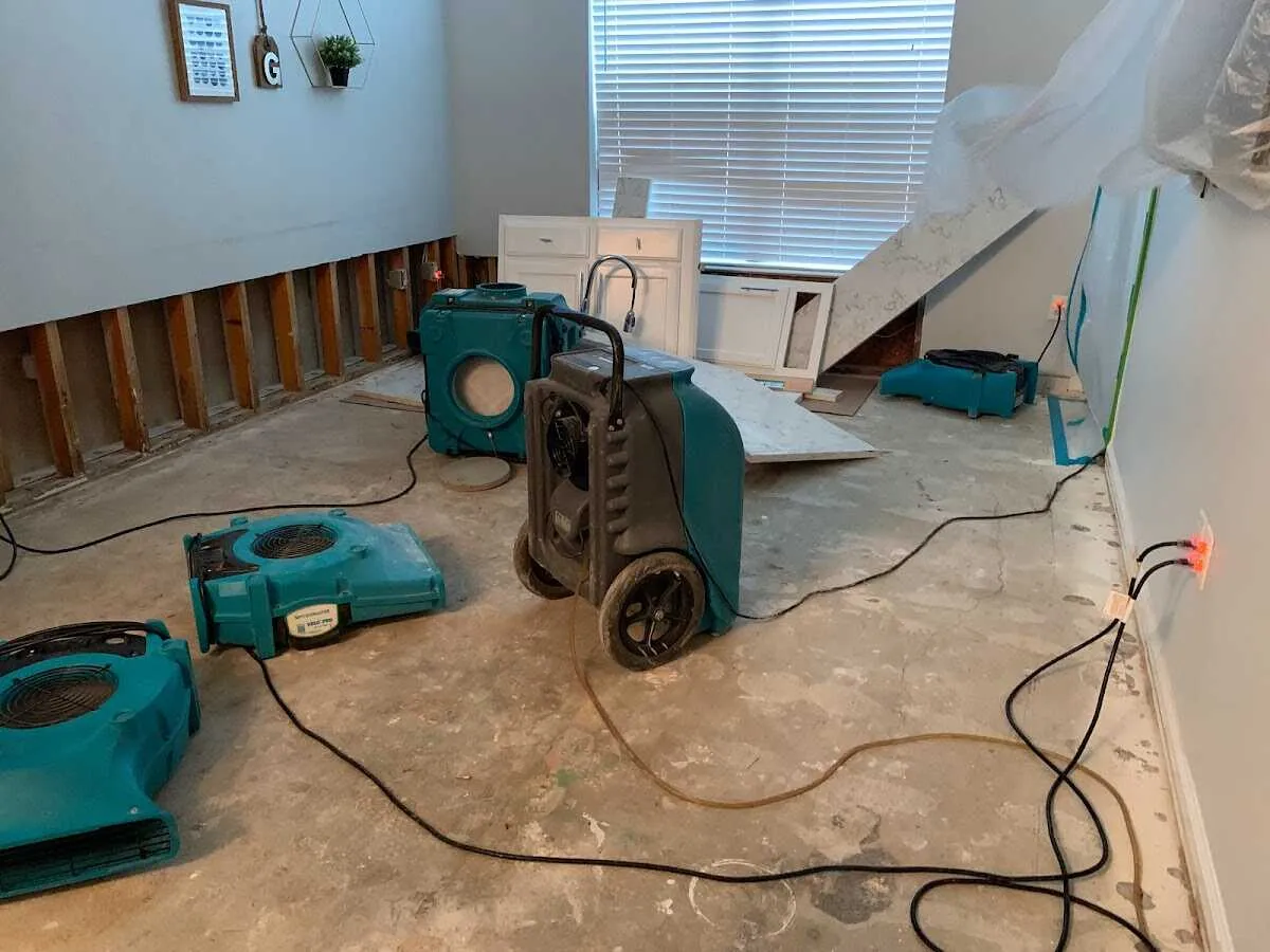Dehumidifier in flood-cut room for Water Damage Restoration in Millis